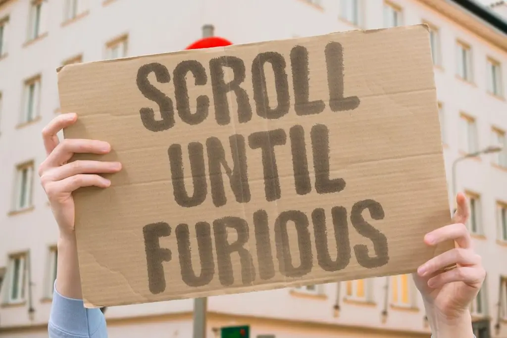 Sign suggesting people should scroll until they are furious.